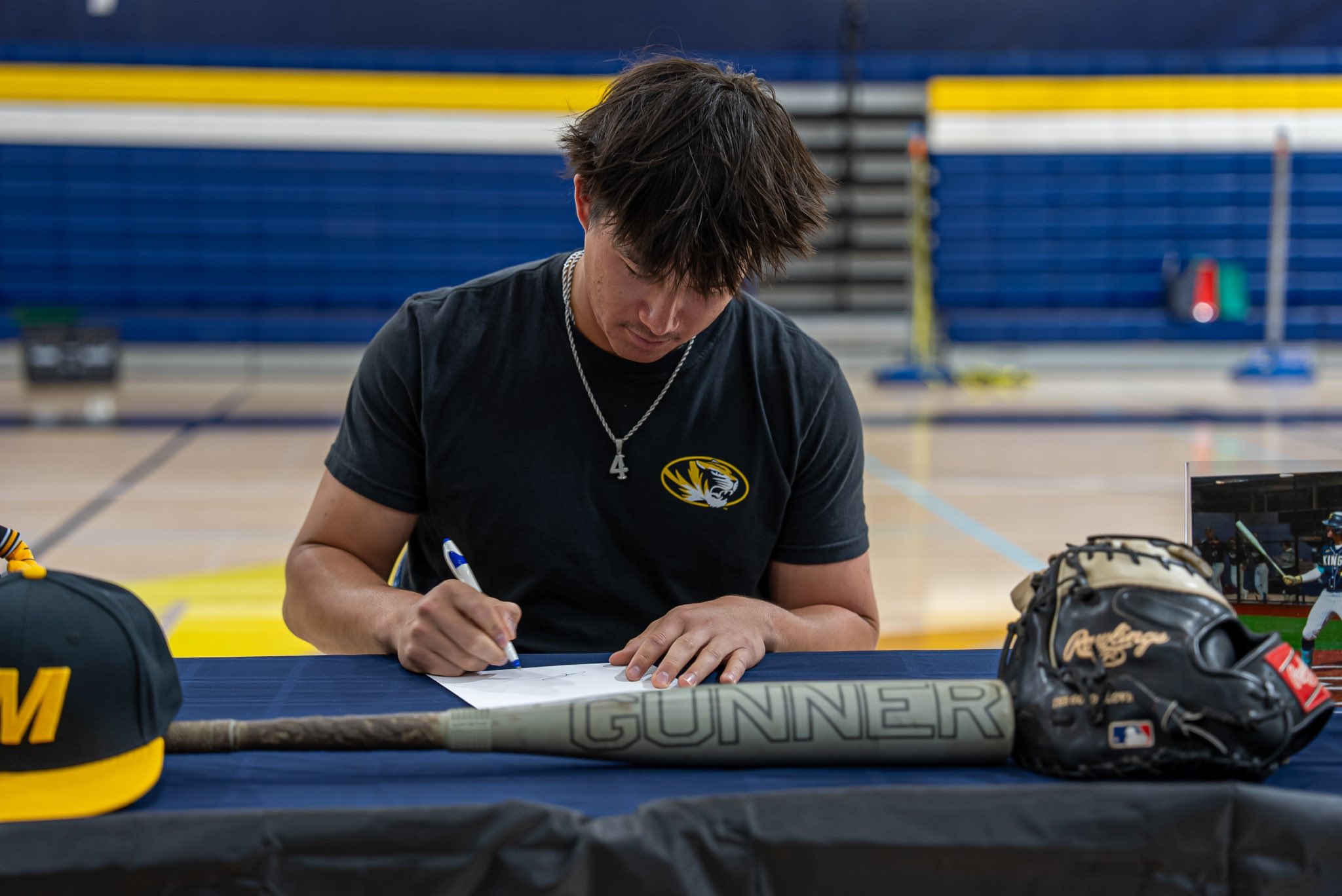 Student athlete signing commitment